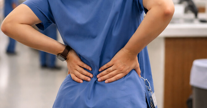 Why Standing All Day Triggers Discomfort in the Lower Back (Occupational & Posture-Related Back Pain) image
