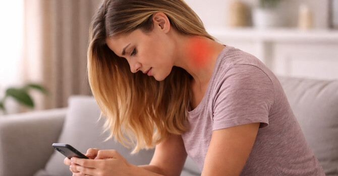 Why Looking Down at Your Phone Is Causing Your Neck Pain